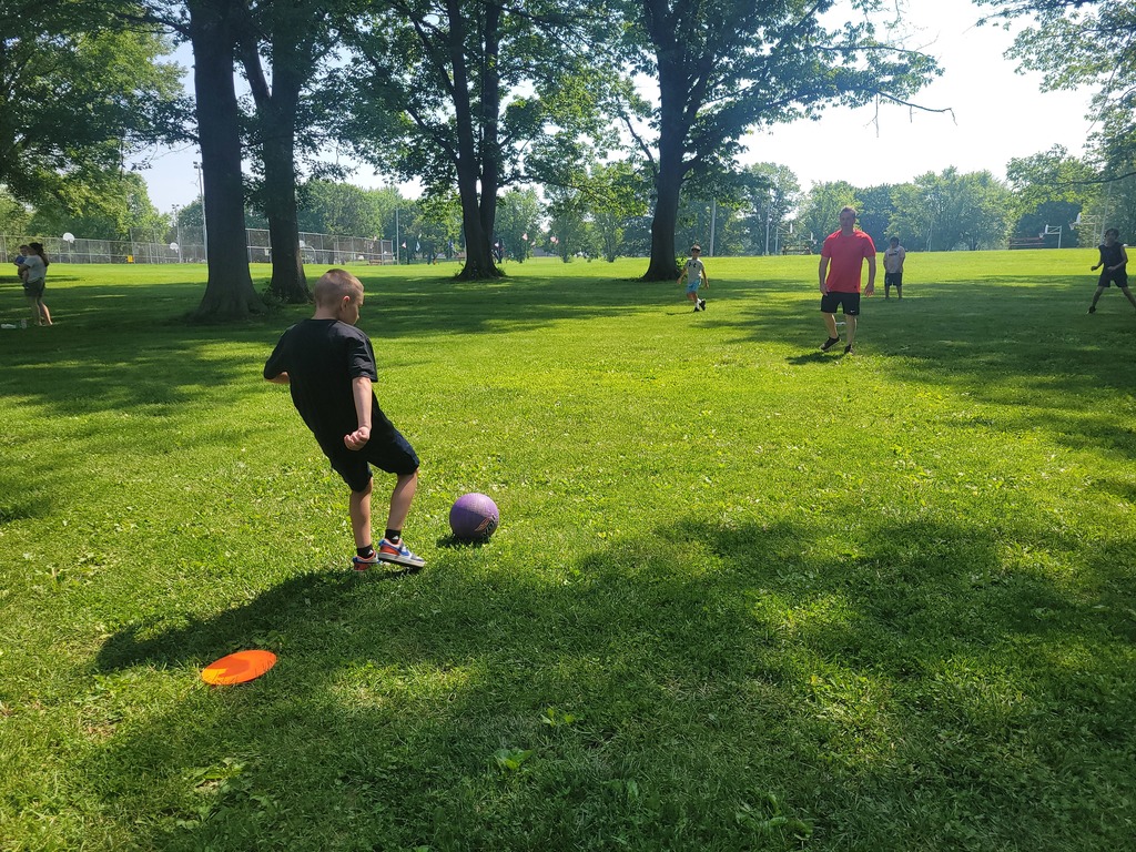 boys playing kickball