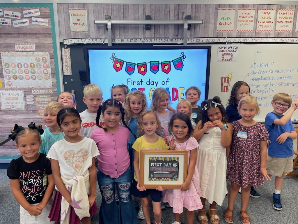 children posing for a photo on the first day of 1st grade