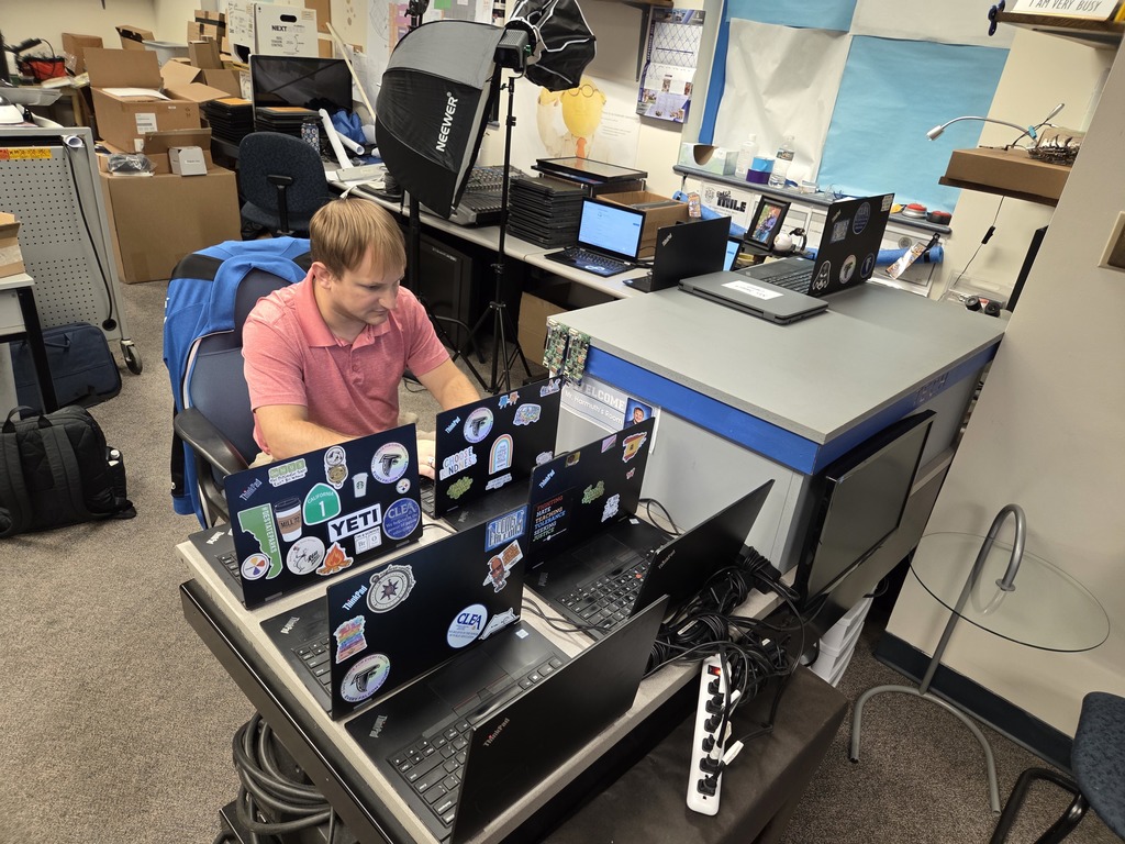 Chris working on laptops