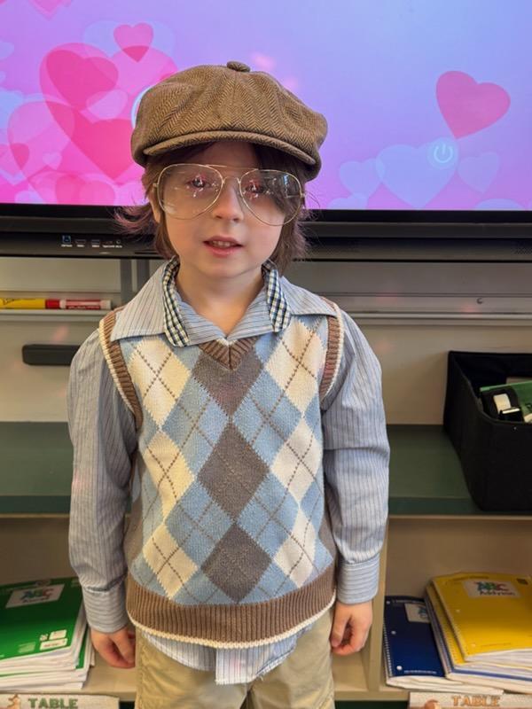 Kindergarten boy dressed like an old man with wire rimmed glasses