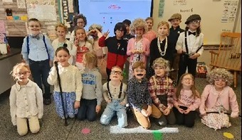 1st grade class of students dressed up as 100-year-olds to cleberate the 100th day of school