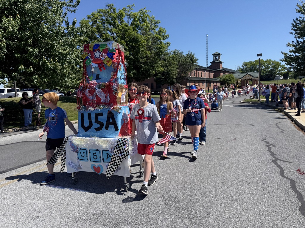 Ebenezer Elementary students walk with their parade float