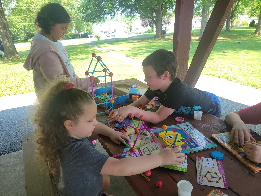 Two students building a structure during Falcons Connect