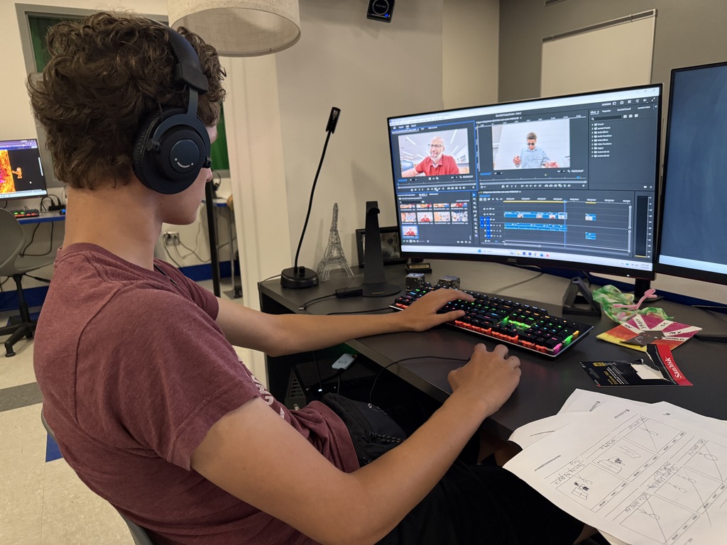 A Falcon Film Camp participant edits a video
