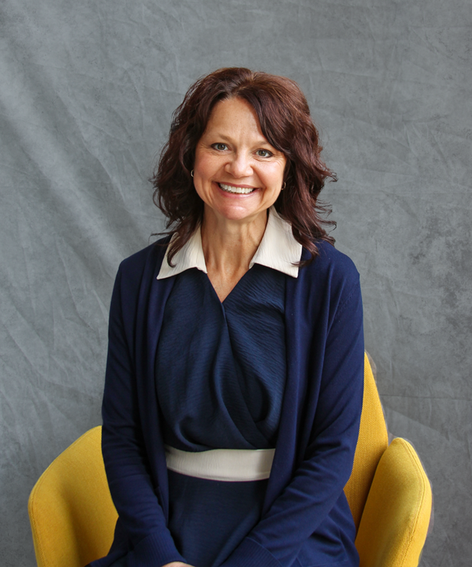 Kerrie Becker portrait photo of her seated in a chair