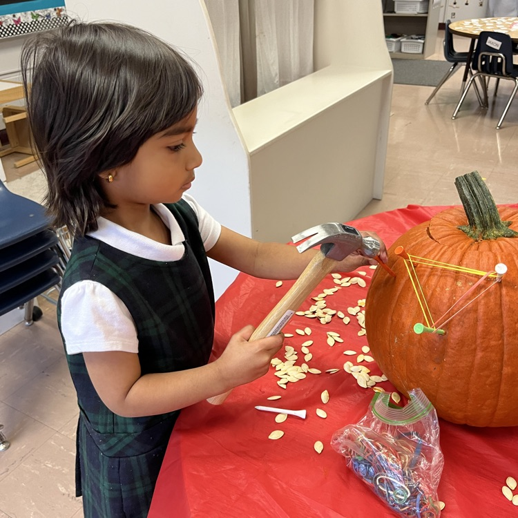 PreK loved making a geoboard out of our pumpkins.