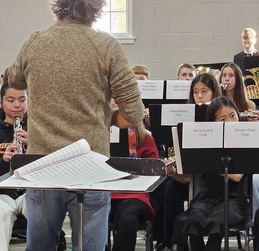 Student playing the flute in an ensemble.