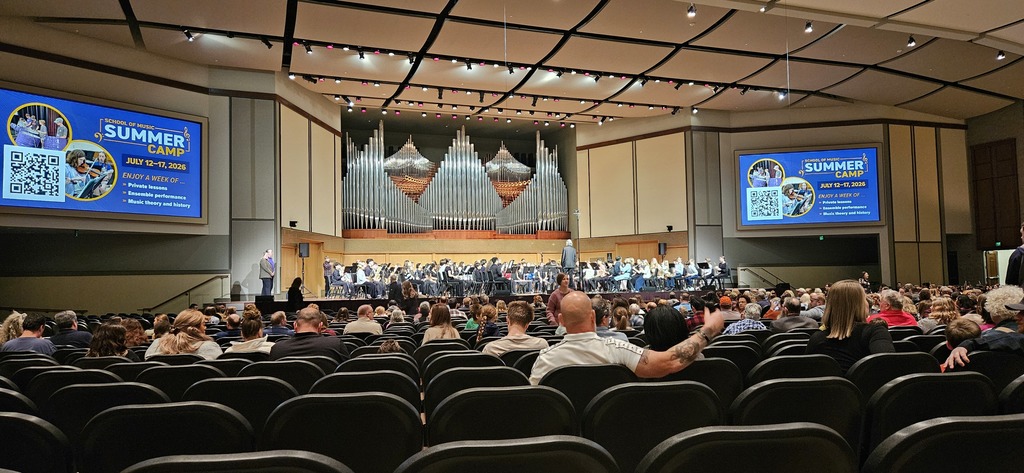 Olivet Nazaren University Concert Hall with a beautiful stage and ornate pipe organ.