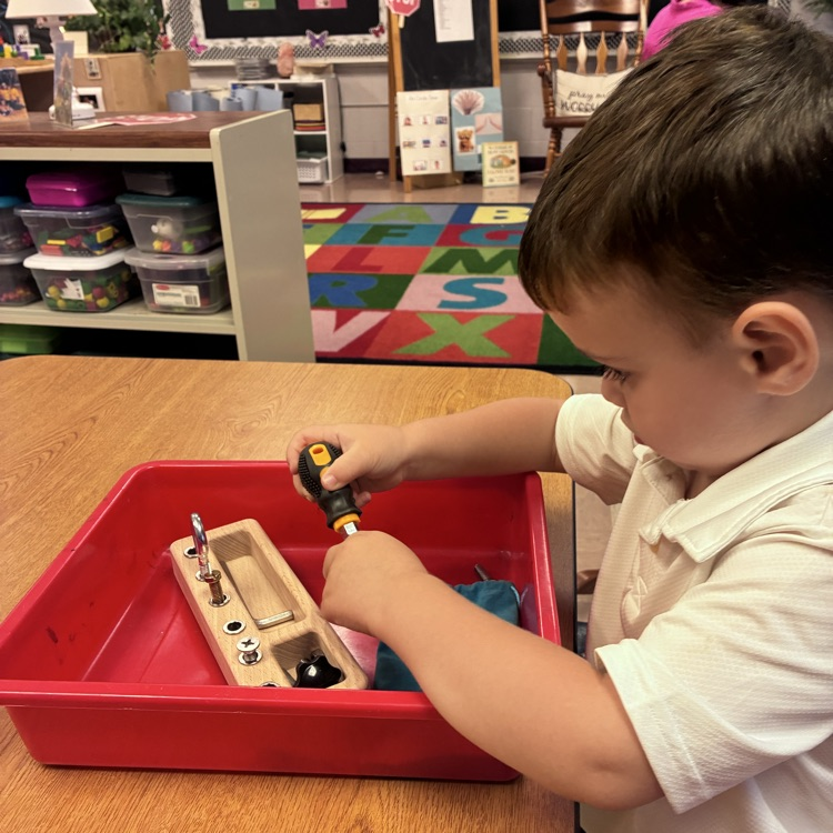 There are practical life trays scattered throughout our centers for the preschoolers to learn with.