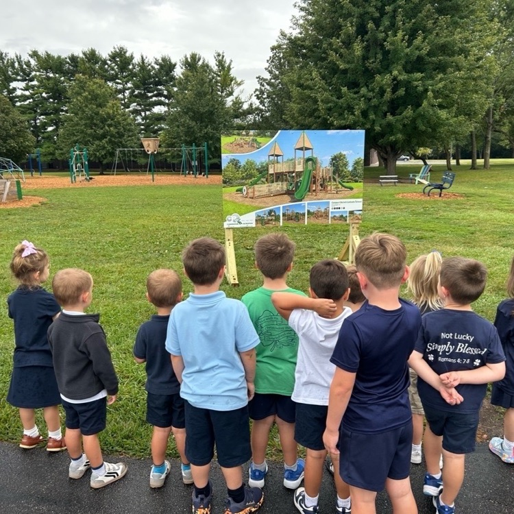 checking out the plans for our new playground 