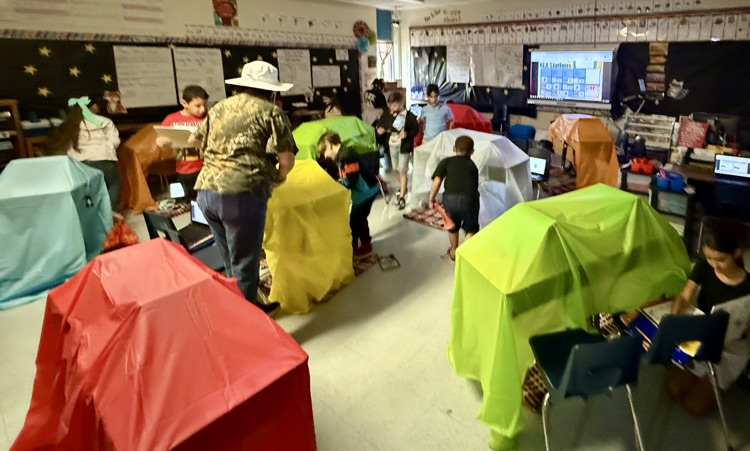Camping out for reading! 🏕️ Ms. Castillo's 3rd graders had a blast during their RLA stations today, turning the classroom into a campsite. What a fun and innovative way to learn!