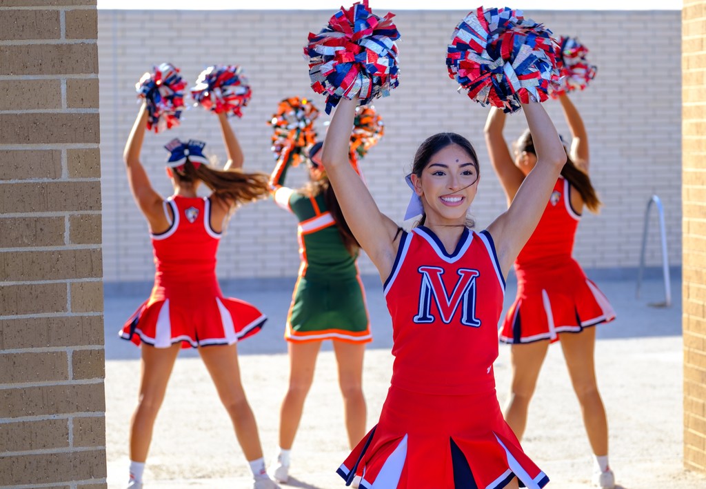 Veterans memorial cheerleader cheering