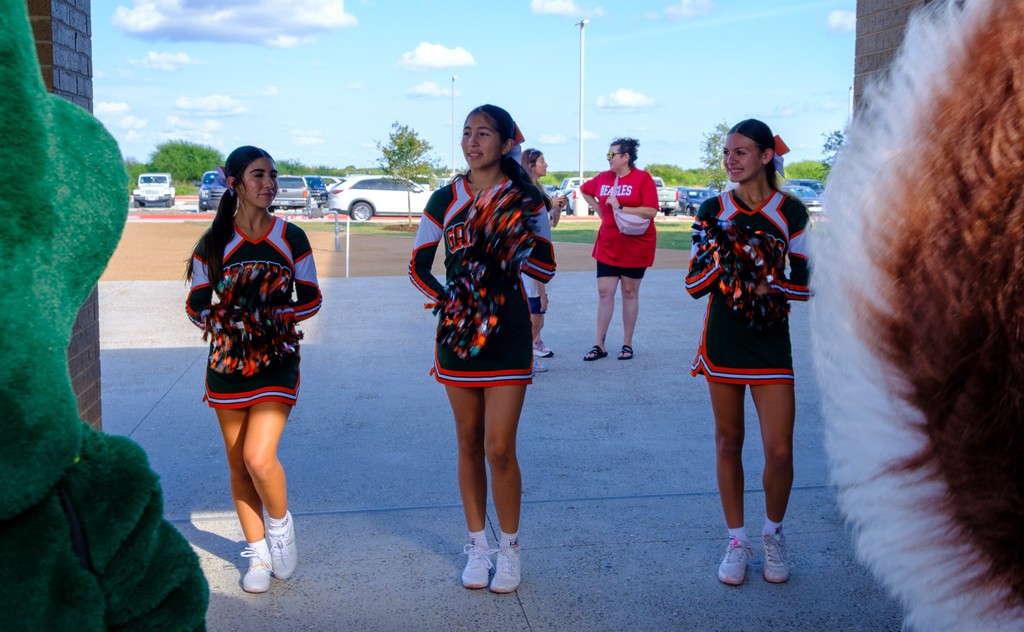 lex cheerleaders welcoming guest into the ribbon cutting