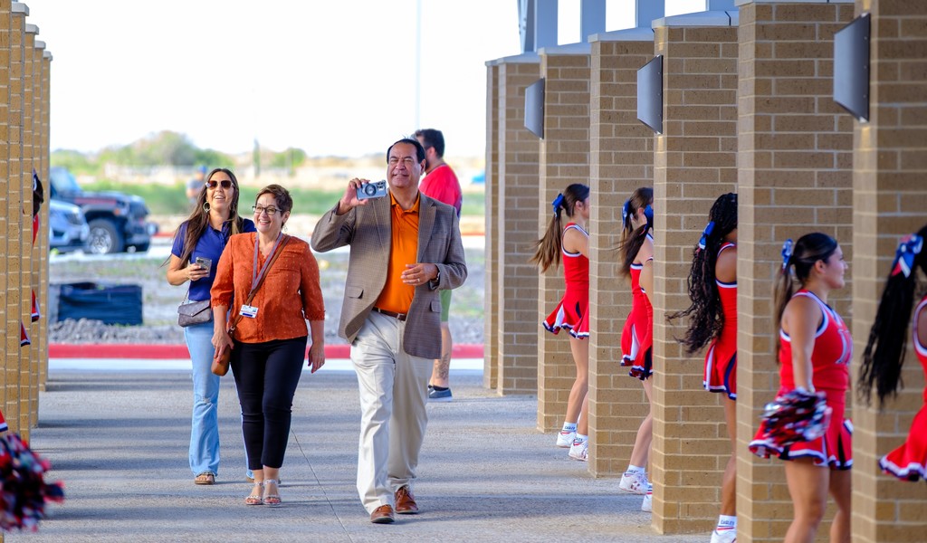 Superitendents walking in to the ribbon cutting