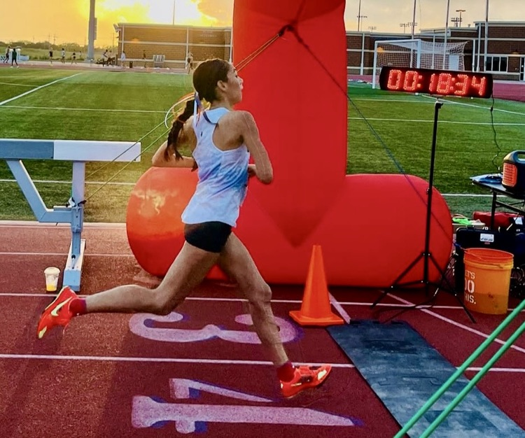 image of student crossing the finish line