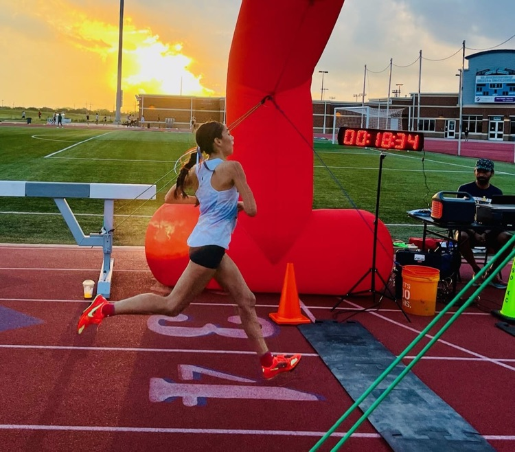 image of Eliana running at cross country meet