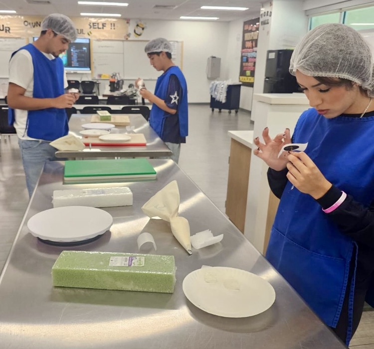student making rose with piping bag 