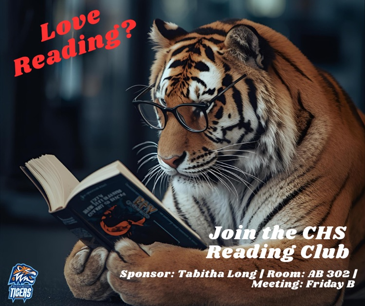 Alt Text: Tiger wearing glasses reading a book.
