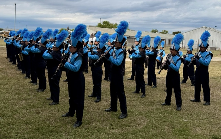 Alt Text (for all images): Carroll High School Tiger Band and Color Guard members performing and posing proudly at the UIL Area Marching Contest, showcasing teamwork, precision, and school spirit.