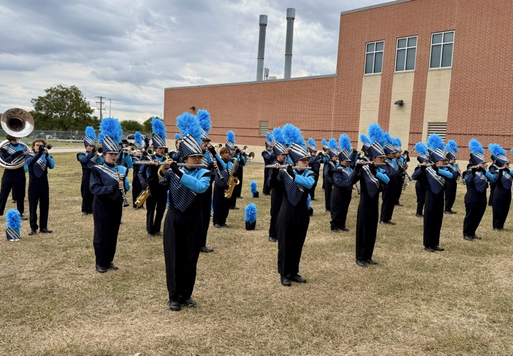 Alt Text (for all images): Carroll High School Tiger Band and Color Guard members performing and posing proudly at the UIL Area Marching Contest, showcasing teamwork, precision, and school spirit.