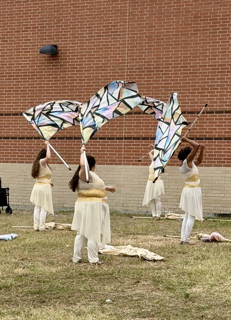 Alt Text (for all images): Carroll High School Tiger Band and Color Guard members performing and posing proudly at the UIL Area Marching Contest, showcasing teamwork, precision, and school spirit.