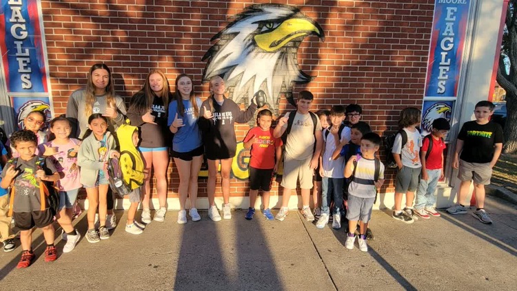 islander volleyball team greeting students Friday morning