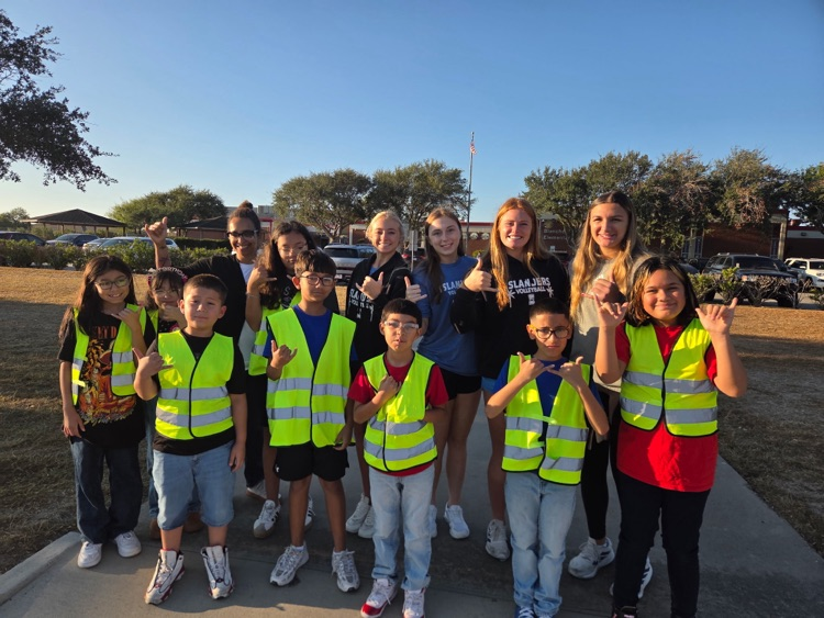 islander volleyball team greeting students Friday morning.