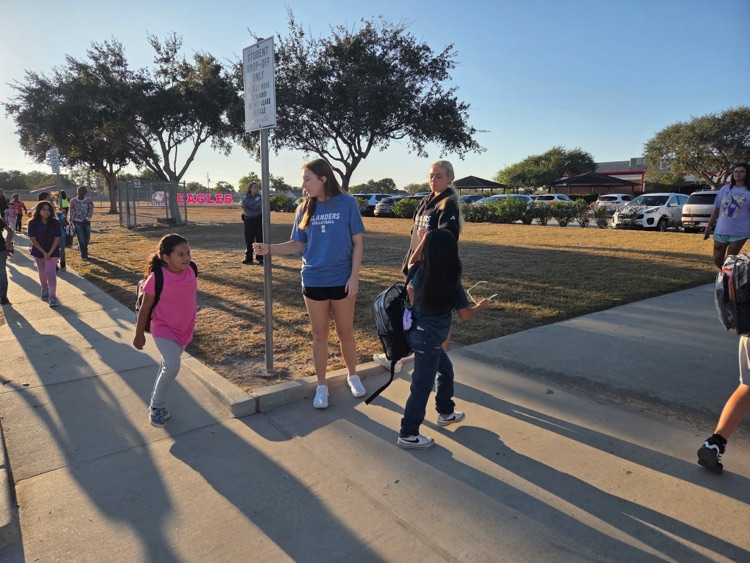 islander volleyball team greeting students Friday morning.