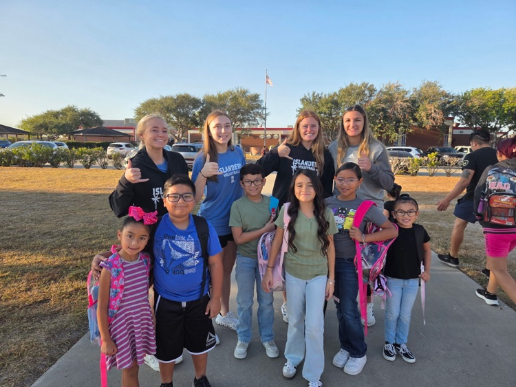 islander volleyball team greeting students Friday morning.
