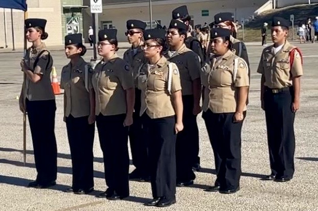 ⸻  Short alt text: Cadets from Carroll NJROTC compete in drill and PT events at Southwest High School in San Antonio.