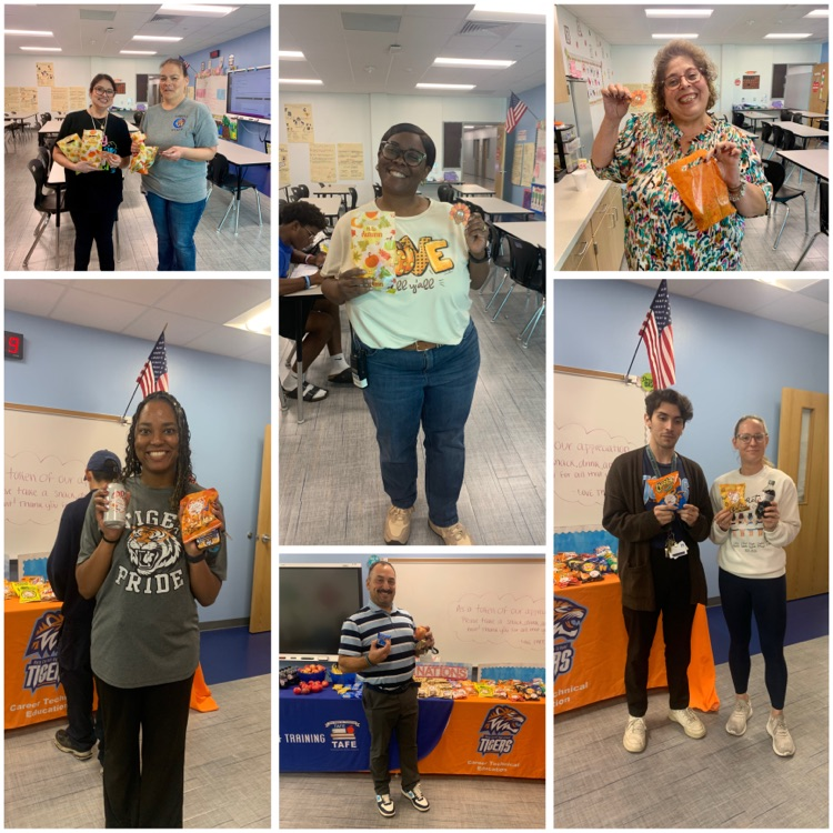 Students and staff at Carroll High School smiling and holding snacks during Gratitude Week activities.