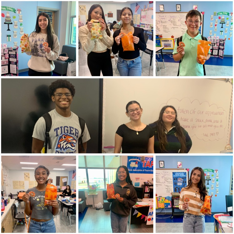Students and staff at Carroll High School smiling and holding snacks during Gratitude Week activities.