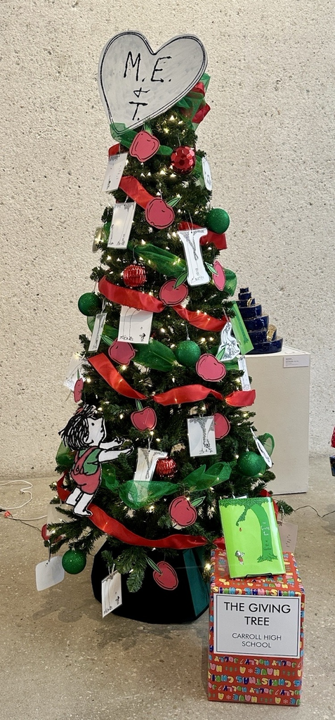 Students and sponsors from Carroll pose proudly beside their decorated literary-themed Christmas trees at the Art Museum of South Texas.