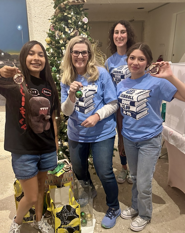 Students and sponsors from Carroll pose proudly beside their decorated literary-themed Christmas trees at the Art Museum of South Texas.