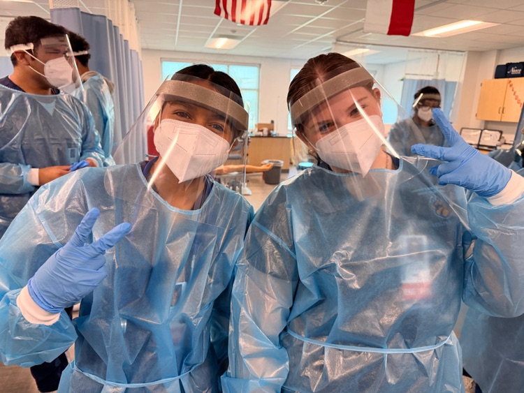 Medical Assistant students wearing PPE during a hands-on donning and doffing lab in class.