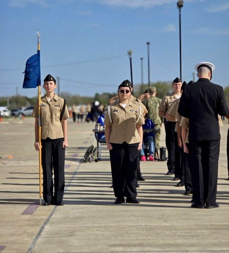 CHS NJROTC cadets performing PT and standing in formation during the Coastal Bend Classic Drill Meet.