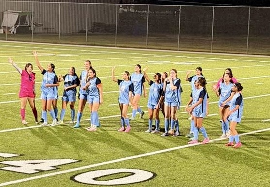 Lady Tigers soccer team celebrating after a win over Moody.