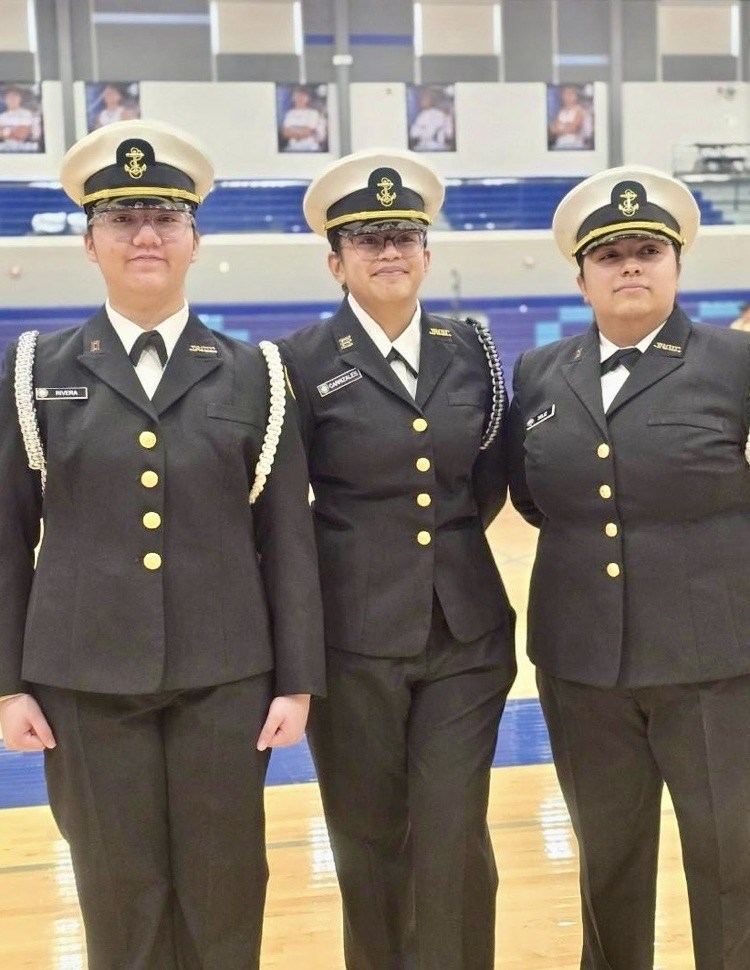 Alt text: NJROTC cadets in formal uniforms standing in formation inside a school gym during the Area Managers Inspection, including close-up and wide shots showing cadets at attention and leadership addressing the group.
