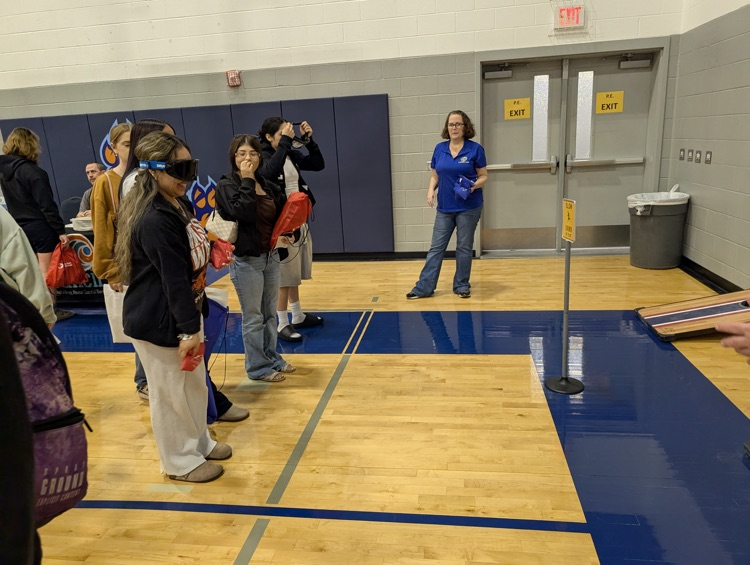 ⸻ Short alt text (Option B style – tighter): Carroll students engaging with community partners during the Youth Traffic Safety Event in the gym.