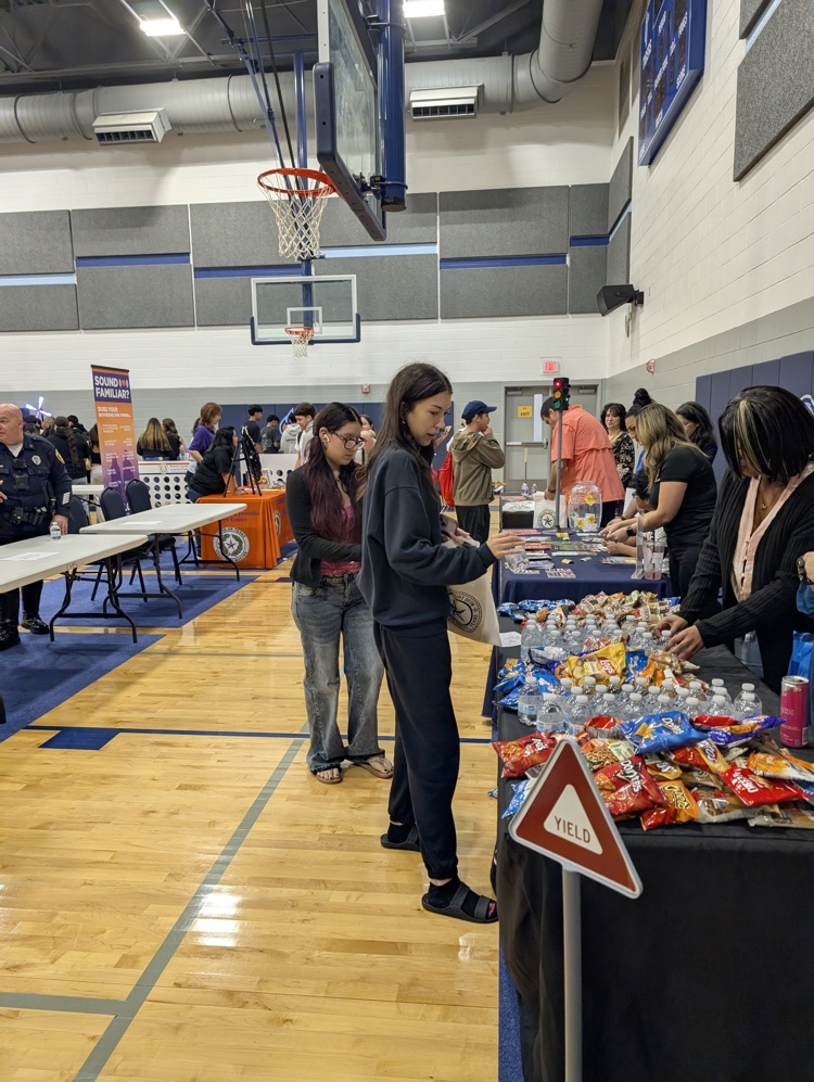 ⸻ Short alt text (Option B style – tighter): Carroll students engaging with community partners during the Youth Traffic Safety Event in the gym.