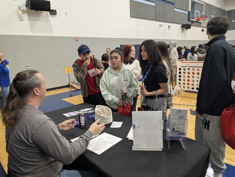 ⸻ Short alt text (Option B style – tighter): Carroll students engaging with community partners during the Youth Traffic Safety Event in the gym.