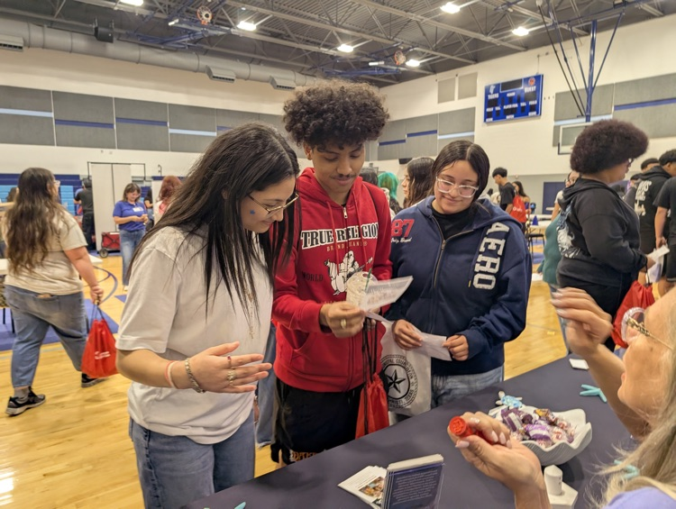 ⸻ Short alt text (Option B style – tighter): Carroll students engaging with community partners during the Youth Traffic Safety Event in the gym.