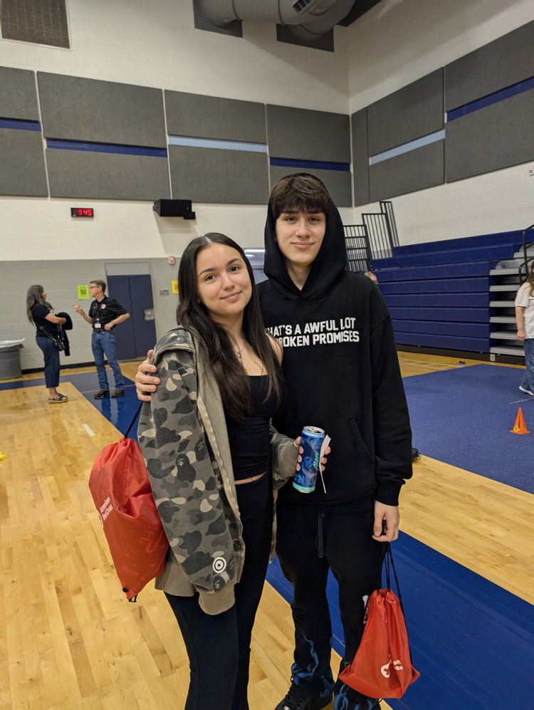 ⸻ Short alt text (Option B style – tighter): Carroll students engaging with community partners during the Youth Traffic Safety Event in the gym.