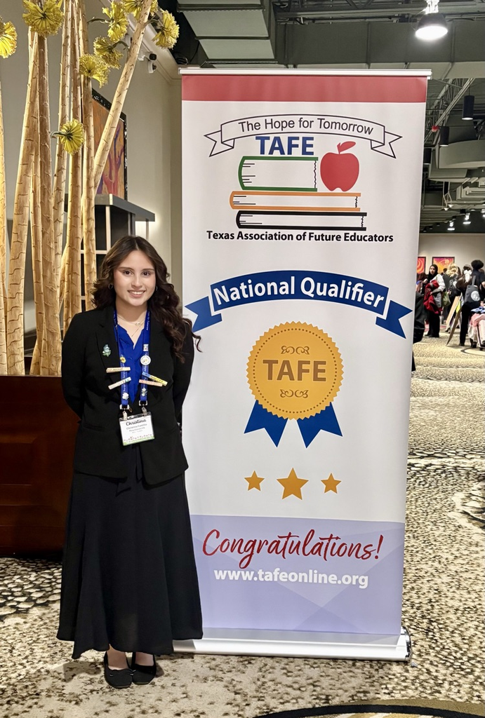 Two Carroll TAFE students stand beside a National Qualifier banner after advancing to Nationals in Children’s Literature and Interactive Bulletin Board.