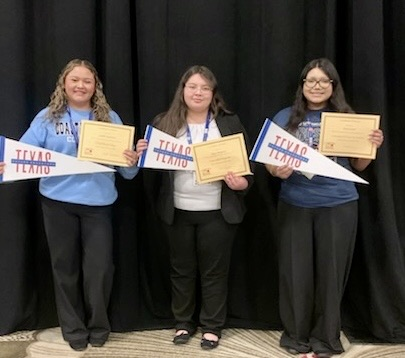 TAFE students sign college commitments as education majors at the state competition in Dallas, holding certificates and college pennants.