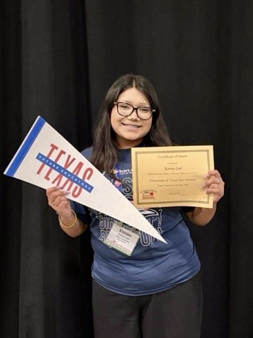 TAFE students sign college commitments as education majors at the state competition in Dallas, holding certificates and college pennants.
