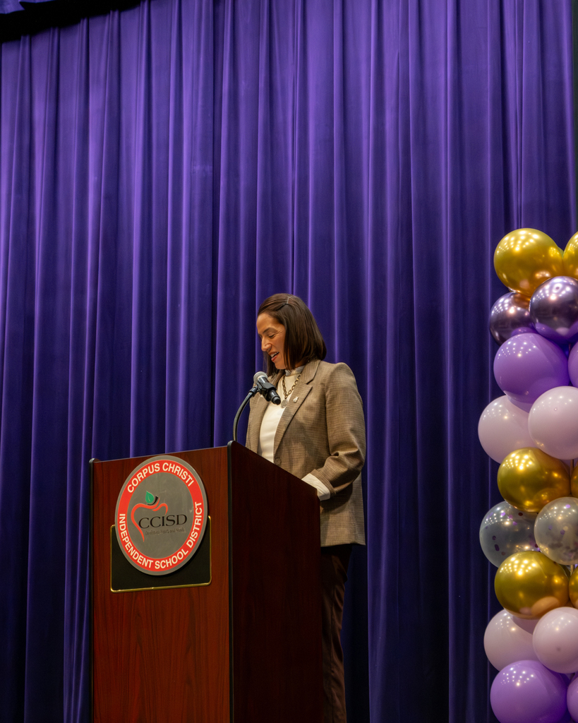 Dolly Gonzales Trolley speaking at a podium. 
