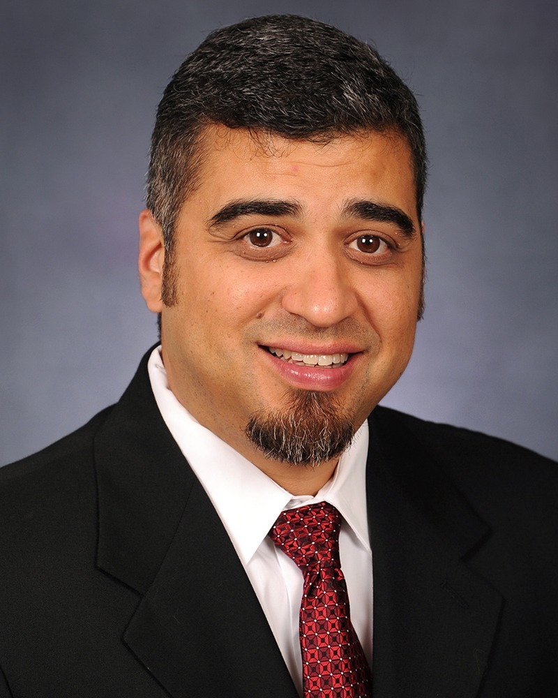Professional headshot of Dr. Marc Aguilera