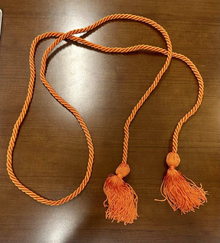  Alt Text: Graphic explaining CCMR graduation cord qualifications alongside an orange graduation cord representing achievement for Class of 2026.