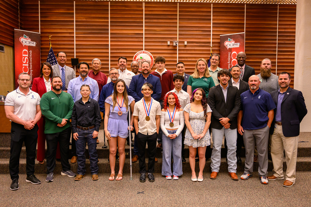 Corpus Christi ISD State Wrestling students pose for a photo during a Board of Trustees Meeting with the CCISD School Board and District Administration. 